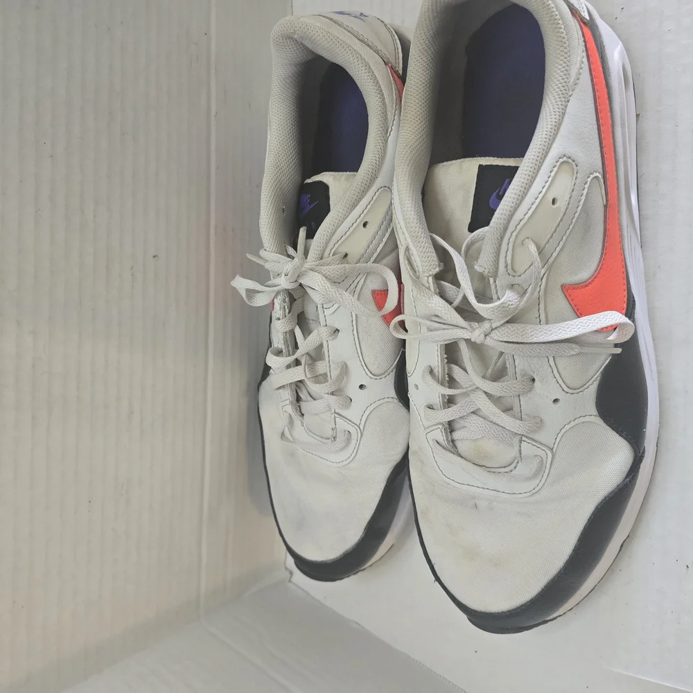 White and Black Athletic Shoes with Orange‎ Highlights